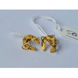 Two identical horse studs one x 15ct gold and one x 9ct - 2.1 inc