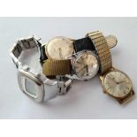 Four assorted wrist watches