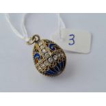 A attractive silver gilt and pique a jour and paste egg shaped pendant