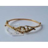 An attractive Victorian 9ct bangle set with seed pearls 9.2g inc