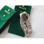 A gents ROLEX oyster precision wrist watch on metal link strap together with papers and two