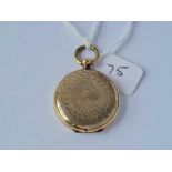 A scroll engraved circular antique gold back & front locket
