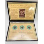 Three anciant Roman coins in case