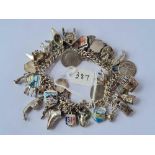 A silver charm bracelet - 85 gms
