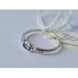A white gold tanzanite and diamond ring 9ct size N