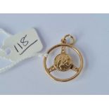A unusual Christopher charm/pendant in the form of a steering wheel 9ct - 3.3 gms