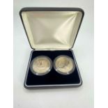 A boxed pair of 1999 £5 coins