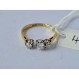 A three stone diamond ring (AF setting) 18ct gold size J