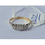 A three stone diamond ring 18ct gold size q - 2.3 gms