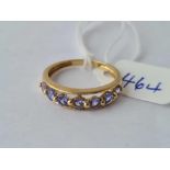 A seven stone tanzanite ring each stone interspersed with a small gold bead 9ct size O - 2 gms