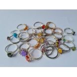 A bag of 25 silver rings 58g inc