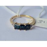 A blue three stone ring 9ct size R - 2.2 gms