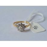 A diamond solitaire ring in star shaped mount 18ct gold size o - 3 gms