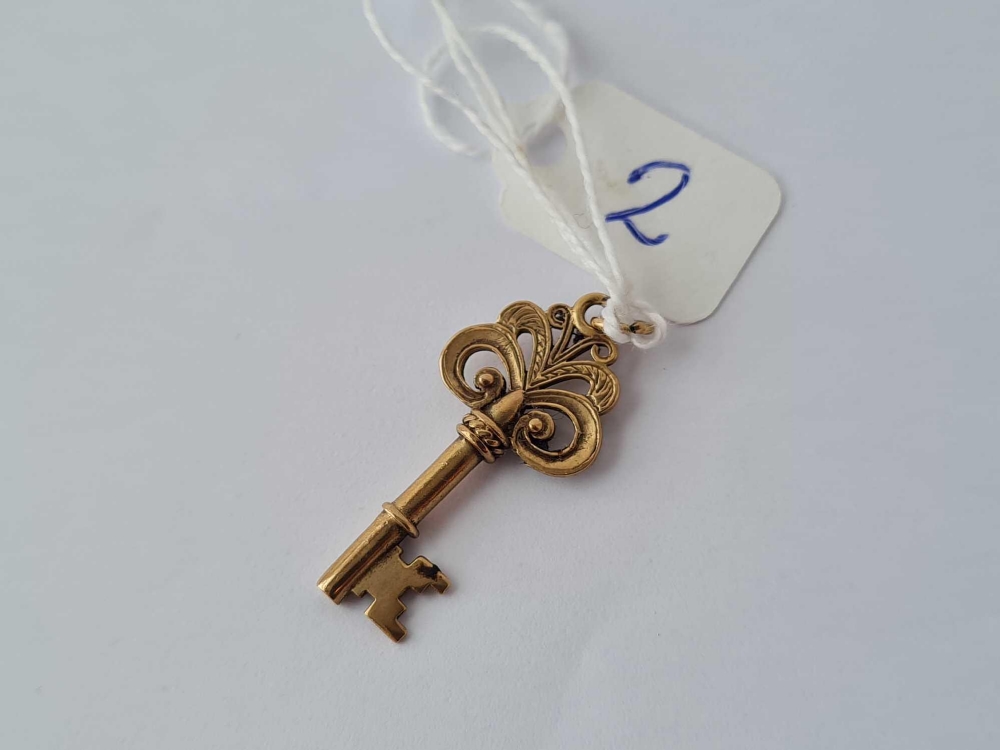 A gold charm in the form of a key 9ct - 2.2 gms - Image 2 of 2