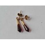 A pair of red stone earrings 9ct - 1.7 gms