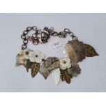 A MOP flower head and leaf necklace on a metal chain