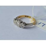 An 18ct gold & platinum three stone diamond ring size J 2.9g inc