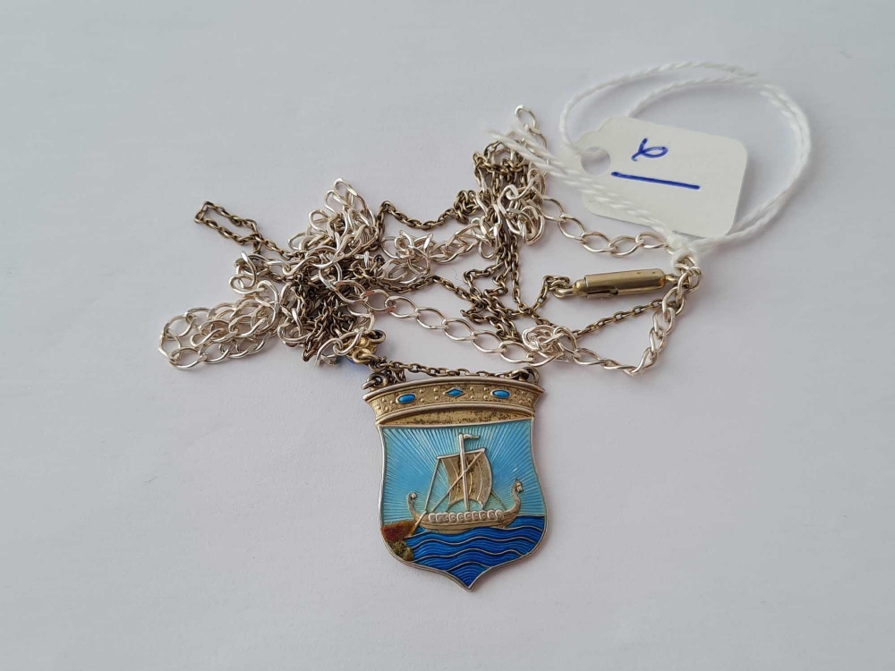 A silver and enamel pendant depicting a Viking boat on chain together with a silver neck chain