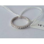 18ct marked white gold ½ ET set with diamonds, size K