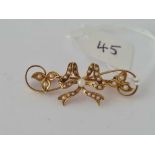 Antique Edwardian 15ct marked bow brooch set with half pearls.