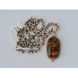 A oblong silver and amber pendant necklace 20 inches - 53 gms
