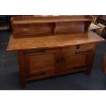 A Liberty & Co Arts and Crafts oak sideboard with iron escutions – 3ft.6” wide