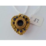 A Victorian novelty yellow metal paste set heart pendant with magnifying telescopic eye glass centre