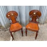 A pair of regency mahogany on turned unfluted legs