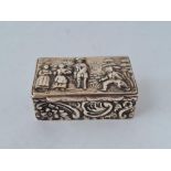 A snuff box, the top embossed with figures, 2" wide, Chester 1915