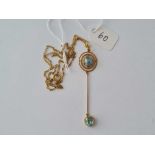 A Edwardian high carat gold (tested) aquamarine pendant and chain