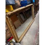 A large gilt framed mirror – 69” wide
