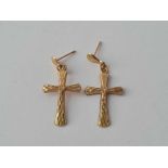 A pair of 9ct cross earrings