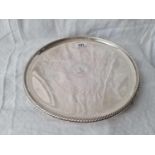 A Victorian salver of late 17th Century design with cable rim and crested centre, 10" diameter,