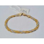 A 9ct yellow & white gold woven bracelet marked Italy 5.7g