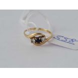 A sapphire three stone ring 9ct size L