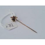 An antique gold Bee stick in set with rubies agate and pearls