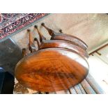 Nest of three figured mahogany oval coffee tables