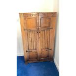 Small oak two door wardrobe with linenfold decoration, 36" wide