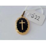 A antique gold and enamel oval memorial locket