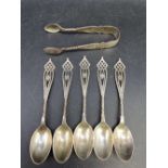 Set of five pierced silver coffee spoons and a pair of tongs