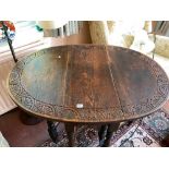 Victorian oak gateleg table with carved border. 30" x 40"