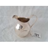 Helmet shaped cream jug with loop handle. 3” high . Birmingham 1911. By TH. 62Gms