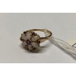 A attractive opal and sapphire cluster ring 14ct gold size R – 3.1 gms