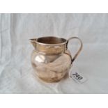 A cream jug with reeded loop handle, 3" high, Birmingham 1911, 101g