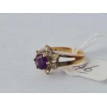 An amethyst and white stone 9ct flowerhead ring size J 2.6g inc