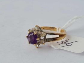 An amethyst and white stone 9ct flowerhead ring size J 2.6g inc