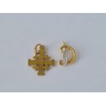 An 18ct gold diamond set letter ‘D’ charm and a small 18ct gold cross 1.2g inc