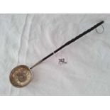 A toddy ladle with whalebone handle and inset with coin dated 1707