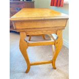 A light oak side table on trestle shaped base with drawer and slide to frieze, 32" wide