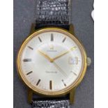 A gents gold plated OMEGA GENEVE wrist watch with seconds sweep and date aperture W/O